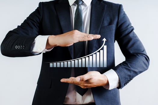 Businessman showing hand showing statistics graph photo