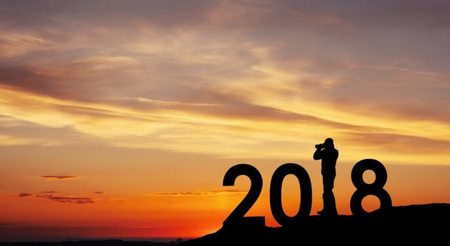 Silhouette young photographer for 2018 new year background of the sunset photo