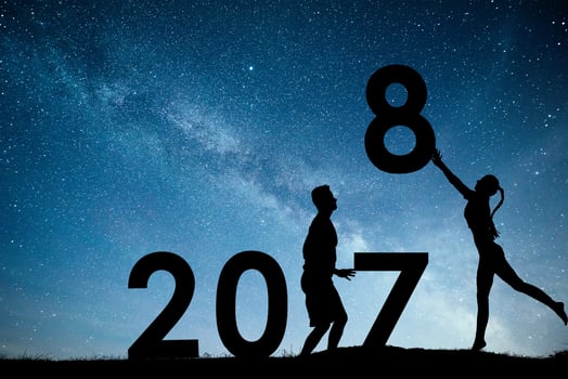Silhouette young girl and guy. Happy 2018 new year. Background of the Milky Way galaxy on a bright star dark sky tone. Concept change year 2017 to 2018 photo