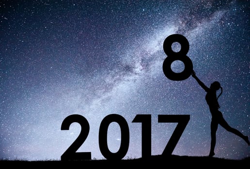 Silhouette young girl. Happy 2018 new year. Background of the Milky Way galaxy on a bright star dark sky tone. Concept change year 2017 to 2018 photo