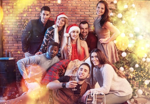 Group of friends celebrating New year holidays together indoors photo