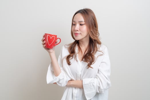 portrait beautiful Asian woman holding coffee cup or mug photo
