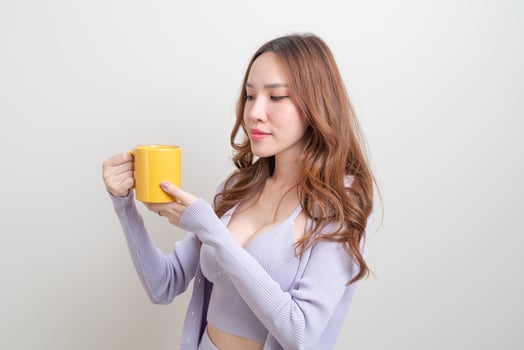 portrait beautiful Asian woman holding coffee cup or mug photo