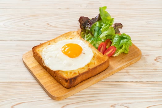 bread toasted with cheese and fried egg photo
