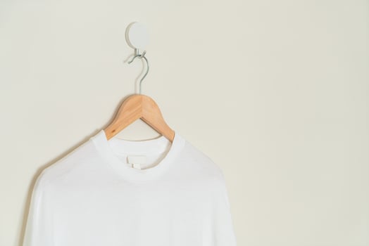 t-shirt hanging with wood hanger photo