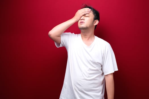 Confused and stress face of Young Asian man with hand gesture. Advertising model concept. photo