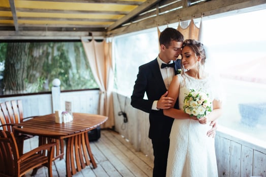 Bride and groom in the cafe an outdoor photo