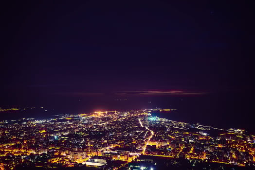 Fantastic aerial view of city illuminated with lights. Location photo