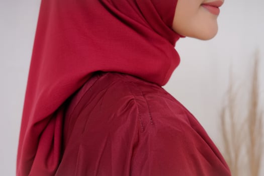 Beautiful islamic female model wearing hijab fashion, a modern lifestyle outfit for muslim woman. Concept a wedding dress, beauty or eidul fitri. A asian girl model wearing hijab on indoor photoshoot photo