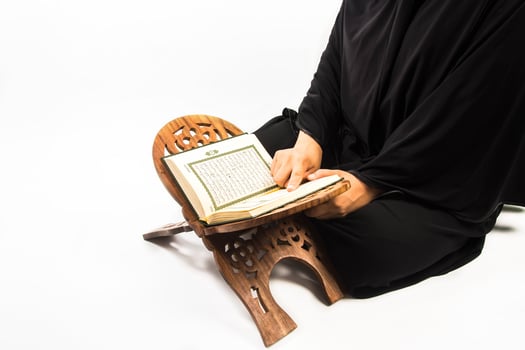 Koran in hand  holy book of Muslims public item of all muslims Koran in hand muslims woman photo