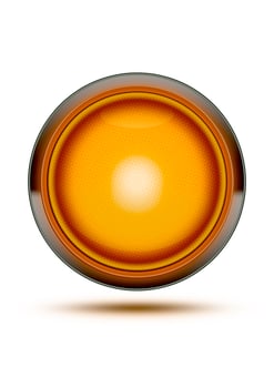 Orange traffic light glowing isolated on white and shadow. Concept for be careful, danger or take care. photo