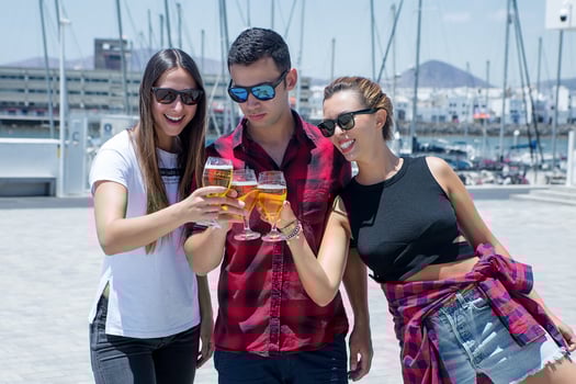 Man clinking glasses with women photo