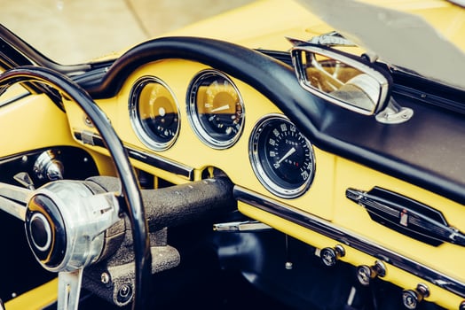 closeup of the headlights and front bumper on vintage automobile photo