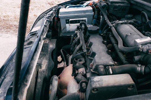 Open hood of the car. View of the engine and vehicle parts. Diagnostics and repair of old car. photo