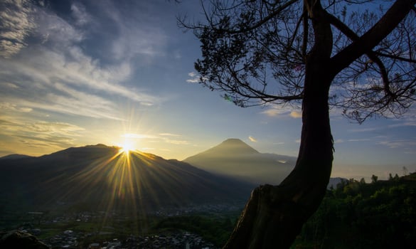 Panoramic sunrise on the mountains located at the Tieng Viewpoint, Wonosobo Regency, Indonesia. photo
