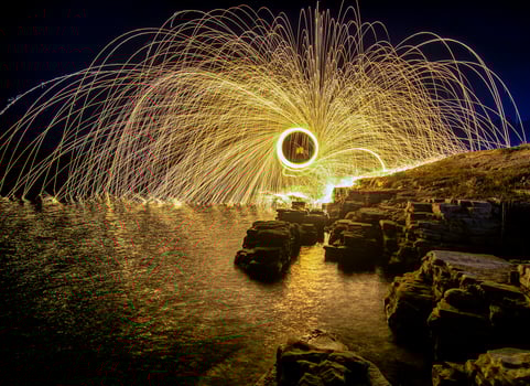 Steel wool photography above the rocks photo