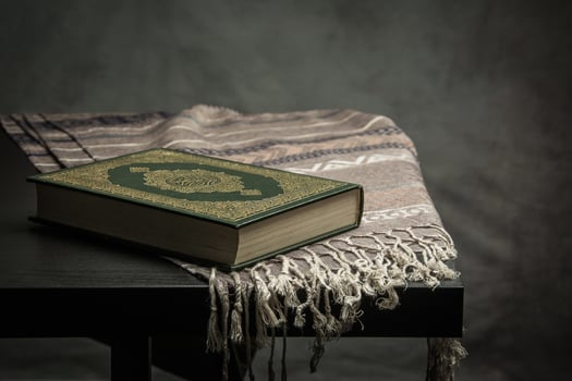 Koran holy book of Muslims  public item of all muslims  on the table , still life photo