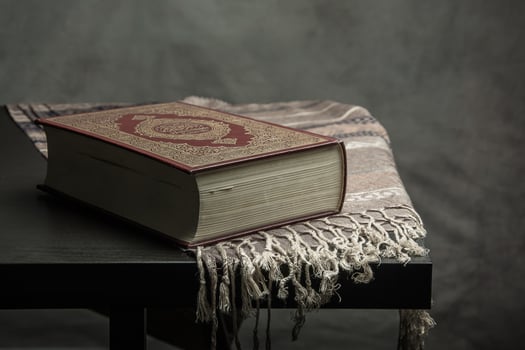 Koran holy book of Muslims  public item of all muslims  on the table , still life photo