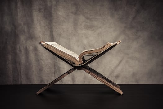 Koran holy book of Muslims  public item of all muslims  on the table , still life photo