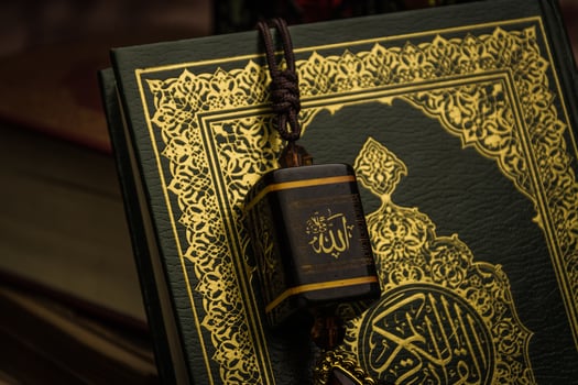 allah god of Islam with Koran - holy book of Muslims  public item of all muslims  on the table  still life photo