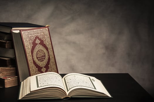 Koran holy book of Muslims  public item of all muslims  on the table , still life photo