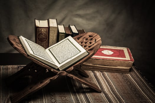 Koran holy book of Muslims  public item of all muslims  on the table , still life photo