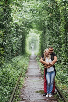 Loving couple on the iron road. Ukraine. photo