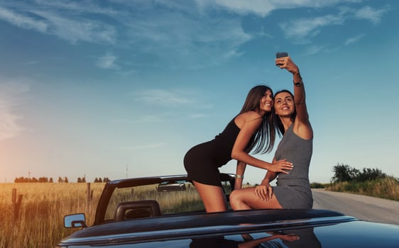 Beautiful two girls are photographed on the road photo