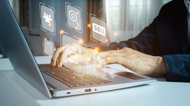 Businessman using a computer for property sales listings. photo