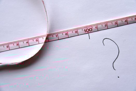 Sewing centimeter centimeter tape tailor's meter measuring tape on a white background photo