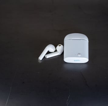 player with headphones on black background photo