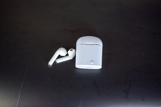 player with headphones on black background photo