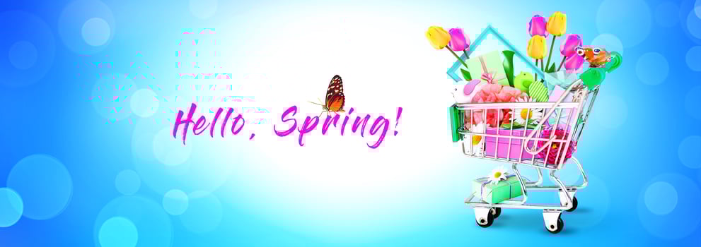 Mini shopping cart with colorful flowers and butterflies. photo