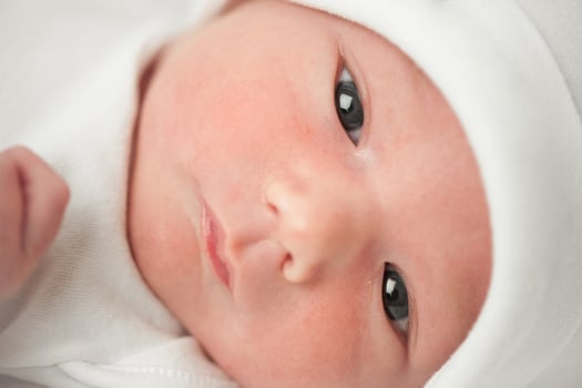 face baby in a white hat photo