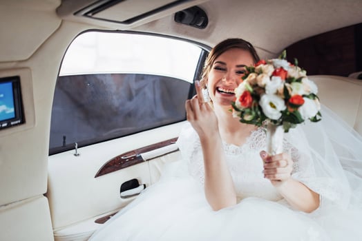 Portrait of a beautiful young bride in the car photo