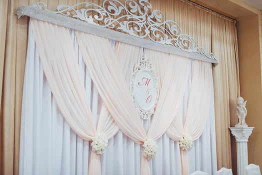 luxury decorated main table in the wedding hall photo