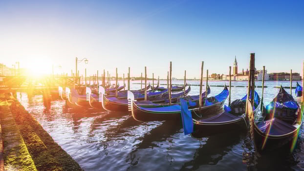 City landscape. Fantastic views of the gondola at sunset, moored photo