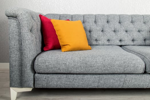 Elegant and trendy view of country styled sofa with colorful pillows photo