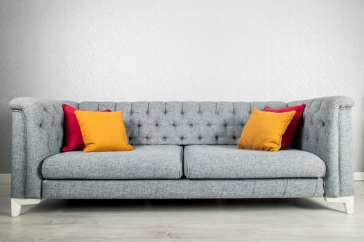 Elegant and trendy view of country styled sofa with colorful pillows photo