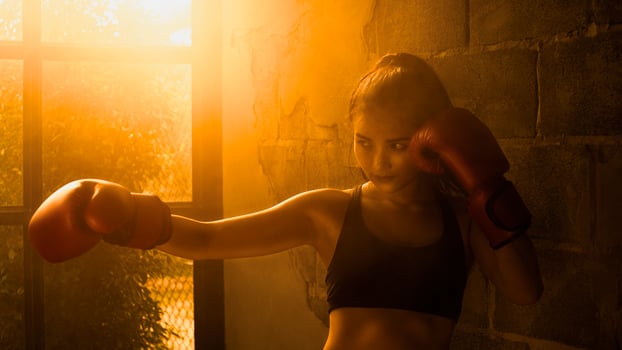 Young Asian women wearing boxing gloves. photo