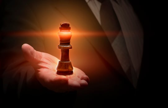 The businessman is handed over the king of chess. Business planning ideas for success photo