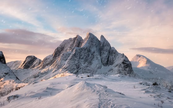 Majestic mountain range with snowfall at sunrise morning photo