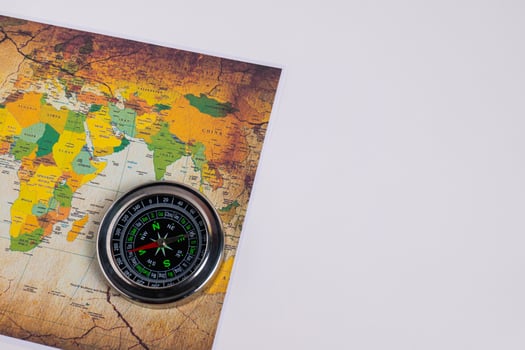 Compass with holiday travel adventure travel map it tells the direction north, south, east, west. photo