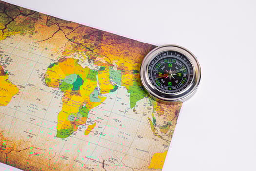 Compass with holiday travel adventure travel map it tells the direction north, south, east, west. photo
