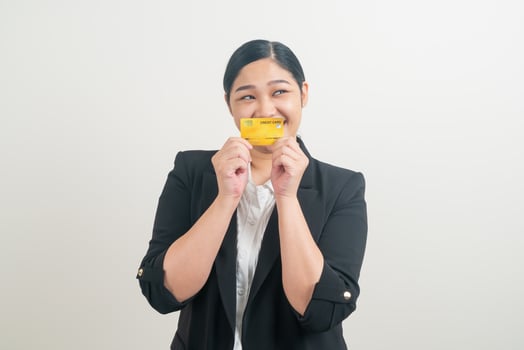 Asian woman holding credit card with white background photo