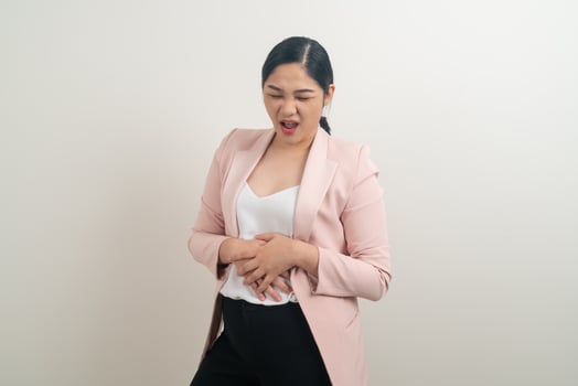 Asian woman have a stomach ache photo