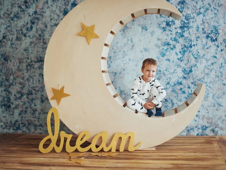 Child in soft and warm pajamas lying photo