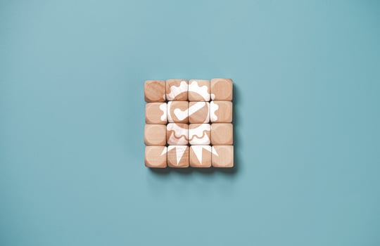 Quality assurance icon which print screen on wooden cube block for quality guarantee and ISO certificate of product and service concept. photo