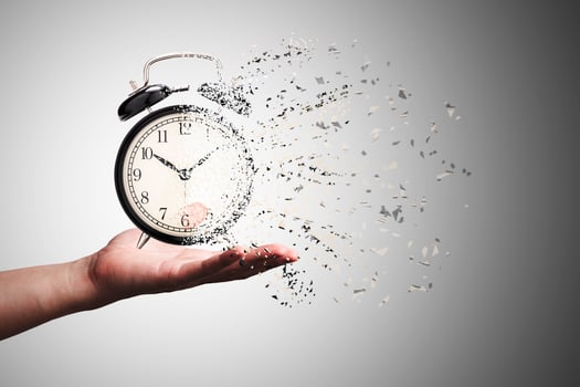 Retro black alarm clock dissolving into a little particles for time can not return and never wait anyone , Time management concept. photo