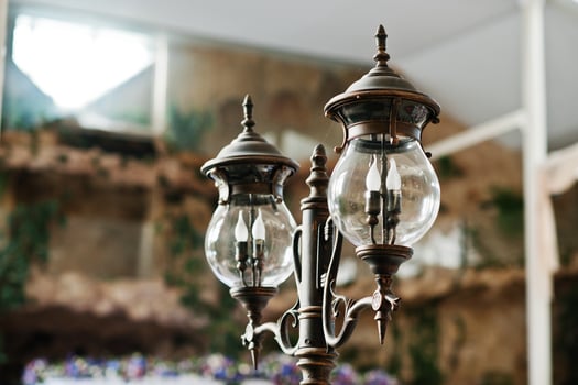 Two old retro lantern on great hall. photo